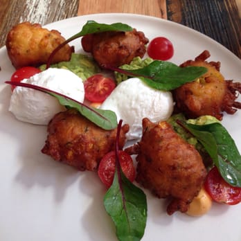 Academy Kitchen & Bar - The corn and zucchini fritters with poached eggs and smashed avo. - Bars Near Me - Richmond, VIC