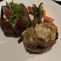 The Keg Steakhouse + Bar - Blue Cheese Filet Mignon with baked potato.