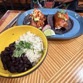 Puesto Mission Valley - Chicken Al Pastor Taco and Carnitas Burrito with Traditional Black Beans and Herb Lime Rice - Mexican Near Me - San Diego, California Puesto Mission Valley - Chicken Al Pastor Taco and Carnitas Burrito with Traditional Black Beans and Herb Lime Rice - Mexican Near Me - San Diego, California