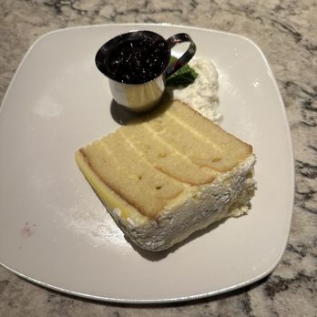 Firebirds Wood Fired Grill - 5 Layer Lemon Cake - Steakhouses Near Me - Dania Beach, Florida Firebirds Wood Fired Grill - 5 Layer Lemon Cake - Steakhouses Near Me - Dania Beach, Florida