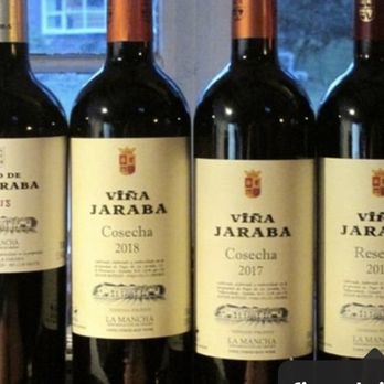 Grapes of Spain - a row of bottles of wine - Wineries Near Me - Lorton, Virginia Grapes of Spain - a row of bottles of wine - Wineries Near Me - Lorton, Virginia