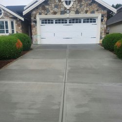 General Concrete - Driveway reno with a new broom finish driveway to complete the face-lift on the front of this home.