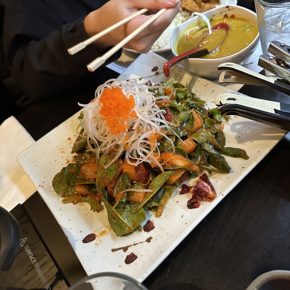 Sushi Motto - a person eating a salad with chopsticks - Japanese Near Me - Anchorage, Alaska Sushi Motto - a person eating a salad with chopsticks - Japanese Near Me - Anchorage, Alaska