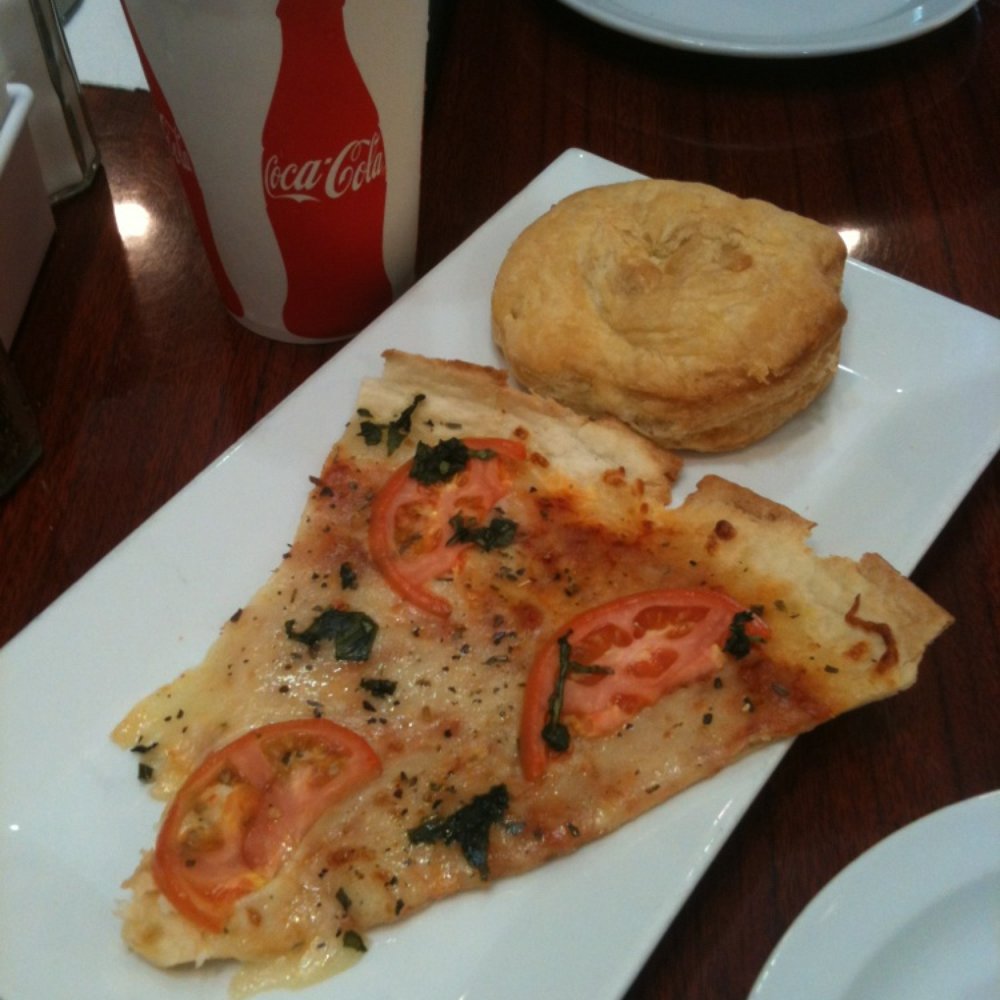 Pizza slice (about $6) and chicken empanada (about $4) Pizza slice (about $6) and chicken empanada (about $4)