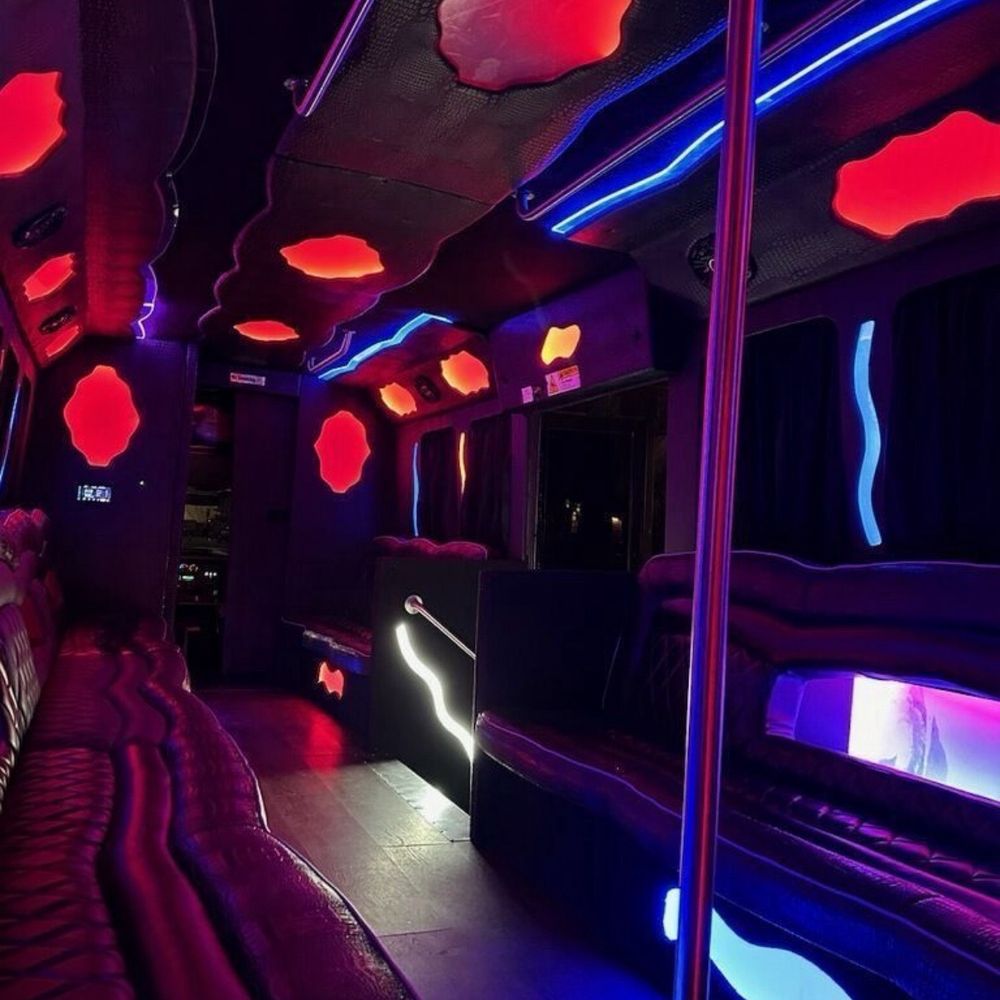 The Big Event Shuttle - A party bus with an open floor and a dance pole. - Limos Near Me The Big Event Shuttle - A party bus with an open floor and a dance pole. - Limos Near Me
