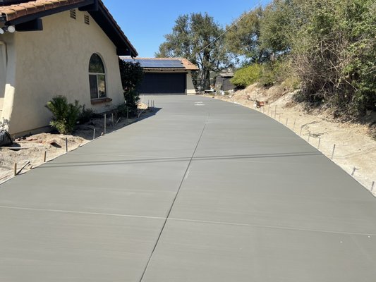 Concrete driveway in FallBrook, Ca - This project has two new man hole covers recently installed and thanks to our knowledge our guys were able to secure them in concrete and take the worry away from our customer. Concrete driveway in FallBrook, Ca - This project has two new man hole covers recently installed and thanks to our knowledge our guys were able to secure them in concrete and take the worry away from our customer.