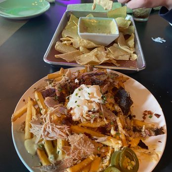 OZ Smokehouse - Cheese (queso) dip and loaded fries. Don't know how they keep the fries CRISPY - Barbeque Near Me - Rogers, Arkansas OZ Smokehouse - Cheese (queso) dip and loaded fries. Don't know how they keep the fries CRISPY - Barbeque Near Me - Rogers, Arkansas