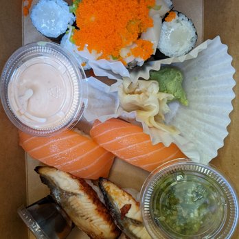 Nogi - A beautifully packaged to go order of spicy scallop roll, salmon sushi, and freshwater eel sushi. Real wasabi on the bottom right. - Sushi Bars Near Me - Atascadero, California Nogi - A beautifully packaged to go order of spicy scallop roll, salmon sushi, and freshwater eel sushi. Real wasabi on the bottom right. - Sushi Bars Near Me - Atascadero, California
