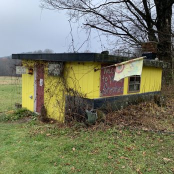 Vermont Shepherd - a yellow shack with graffiti on it - Cheese Shops Near Me - Putney, Vermont