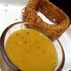 Onion rings with a mango dipping sauce