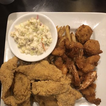 Dons Seafood- Hammond - Shrimp and Catfish Dinner was a PLEASURE to eat even though I couldn't finish it. A new love is French Fries with Louisiana Hot Sauce - Seafood Near Me - Hammond, Louisiana