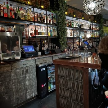 390 Social - a woman sitting at a bar - Venues & Event Spaces Near Me - Brooklyn, New York
