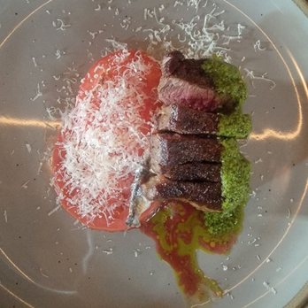 Madre - Sliced filet with salsa verde, caprese, and anchovy - Mediterranean Near Me - Raleigh, North Carolina Madre - Sliced filet with salsa verde, caprese, and anchovy - Mediterranean Near Me - Raleigh, North Carolina