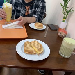 Creamsicle drink, bagel with cream cheese, grilled cheese, matcha drink