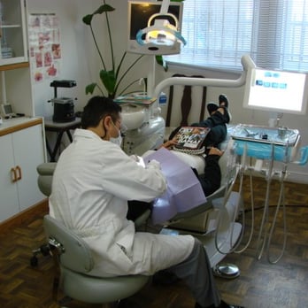 Farzin Farhan, DDS - Farzin Farhan, DDS Working on a Happy Patient-Local Dentist Near Los Angeles - General Dentistry Near Me - Los Angeles, California