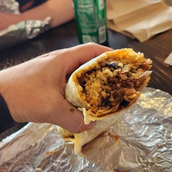 Bomb Burritos & Bowls - Pork burrito with brown rice, black beans, roasted garlic, caramelized onions, shredded cheese, pineapple salsa, and bomb sauce! - Fast Food Near Me - Westerly, Rhode Island Bomb Burritos & Bowls - Pork burrito with brown rice, black beans, roasted garlic, caramelized onions, shredded cheese, pineapple salsa, and bomb sauce! - Fast Food Near Me - Westerly, Rhode Island