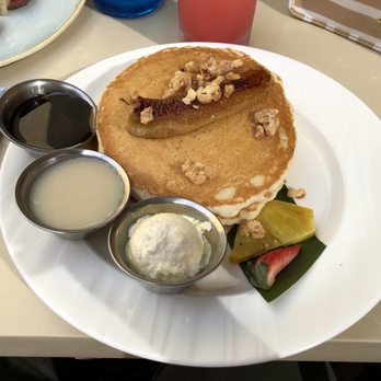 Holoholo Grill - Banana Macadamia Nut Pancakes, with coconut and regular syrup. - Hawaiian Near Me - Koloa, Hawaii Holoholo Grill - Banana Macadamia Nut Pancakes, with coconut and regular syrup. - Hawaiian Near Me - Koloa, Hawaii