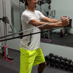 Studio Fitness - Core training doesn't just have to be crunches and leg lifts. Resistance bands are a great way to working on core stability.