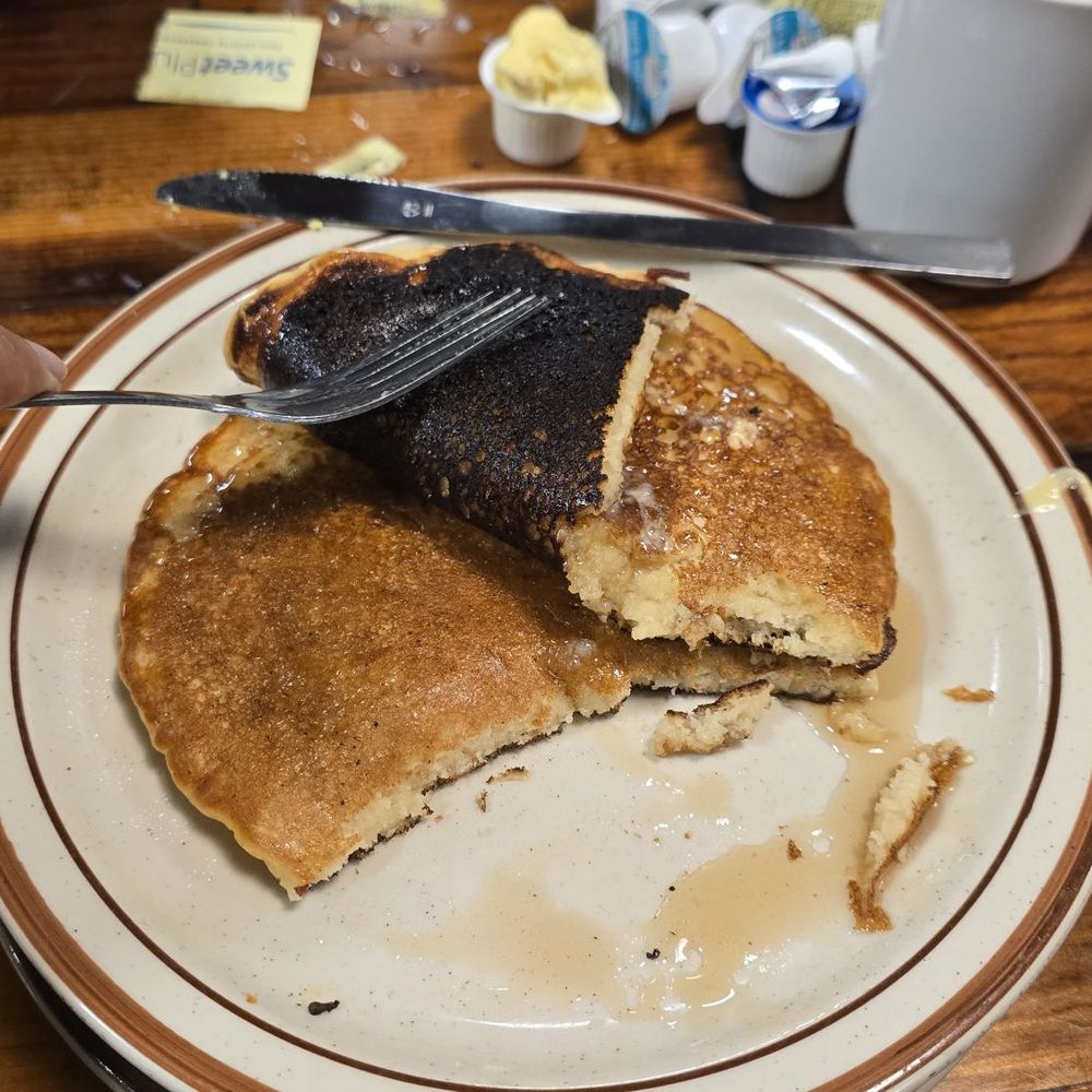 My burned pancakes. Maybe that's why tue food took so long. Have to cook them thoroughly. My burned pancakes. Maybe that's why tue food took so long. Have to cook them thoroughly.