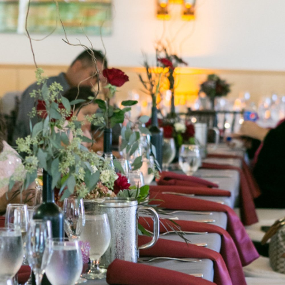 Rosebud Floral Designs - Extra flowers. For these two tables in the picture, we had 4 centerpieces and 5 wine bottle flowers. - Floral Designers Near Me Rosebud Floral Designs - Extra flowers. For these two tables in the picture, we had 4 centerpieces and 5 wine bottle flowers. - Floral Designers Near Me