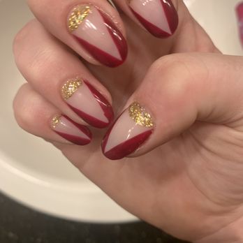 Lux Nail Bar - Bubbles on my clear coat and ringer finger has a wonky line. Only 1 coat on the red part. - Nail Salons Near Me - Sanford, Florida