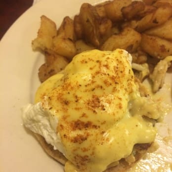 Picantillo - Crab egg Benedict with a side taters - New American Near Me - Pasadena, Maryland