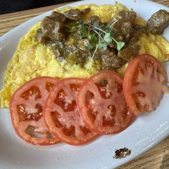 The Brunch House - Pork Chili Verde Omelette with Sliced Tomatos instead of Potatoes - Breakfast & Brunch Near Me - Provo, Utah The Brunch House - Pork Chili Verde Omelette with Sliced Tomatos instead of Potatoes - Breakfast & Brunch Near Me - Provo, Utah