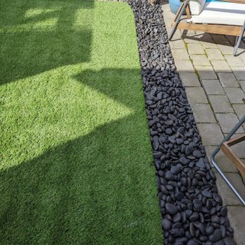 Top Dog Turf - After, with a river rock border added to prevent erosion. - Artificial Turf Near Me - Lakewood, Washington Top Dog Turf - After, with a river rock border added to prevent erosion. - Artificial Turf Near Me - Lakewood, Washington