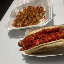 Mobdogs - Our bacon wrapped hotdog and hot Cheetos with an extra order of fries