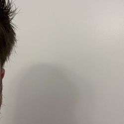 Andrea's Barbershop - Uneven hair.