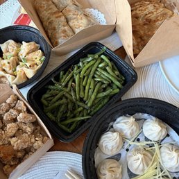 Crispy chicken, chili oil wontons, string beans, xiao long bao, beef roll Crispy chicken, chili oil wontons, string beans, xiao long bao, beef roll