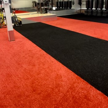 Thats Turf - a red and black floor in a gym - Artificial Turf Near Me Thats Turf - a red and black floor in a gym - Artificial Turf Near Me