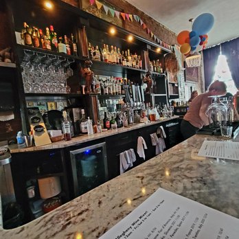 The Allegheny Wine Mixer - a woman pouring a drink - Wine Bars Near Me - Pittsburgh, Pennsylvania