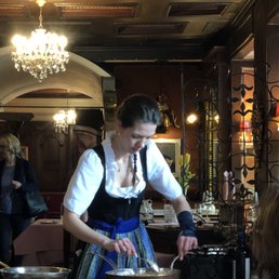 Our waitress preparing traditional schnitzel at the table. Our waitress preparing traditional schnitzel at the table.