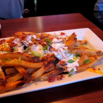 Féile - Loaded Chips with bacon, cheddar, scallions and ranch - Sports Bars Near Me - New York, New York Féile - Loaded Chips with bacon, cheddar, scallions and ranch - Sports Bars Near Me - New York, New York