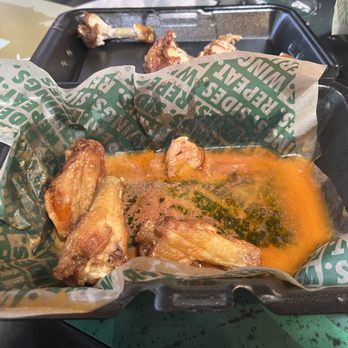 Wingstop - Three of my eight wings, the grease they came in, and I guess there's some sauce if you look for it. - Chicken Wings Near Me - Chattanooga, Tennessee Wingstop - Three of my eight wings, the grease they came in, and I guess there's some sauce if you look for it. - Chicken Wings Near Me - Chattanooga, Tennessee