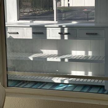 Local Handyman Solutions - This is through a window, but he unboxed this table I bought on Wayfair and put it together. - Plumbing Near Me