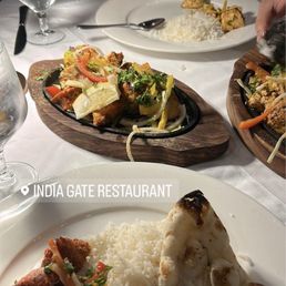 Garlic naan, basmati rice, malai chicken tikka, and chicken tikka