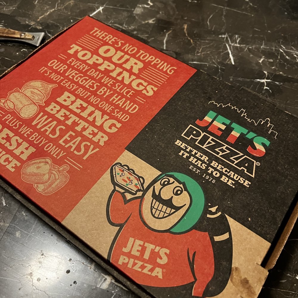 Jet's Pizza - a pizza box on a table - Pizza Near Me - Austin, Texas Jet's Pizza - a pizza box on a table - Pizza Near Me - Austin, Texas