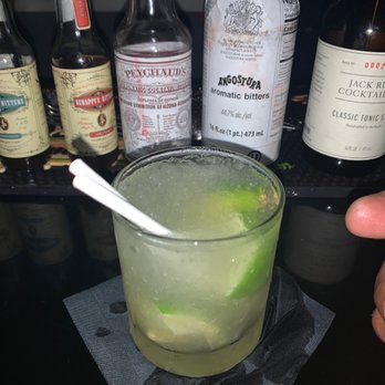 The Dime Bar - a glass of limeade with a spoon in it - Cocktail Bars Near Me - Gainesville, Florida