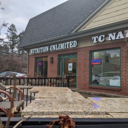 Nutrition Unlimited - They're around the back left corner, they're hard to spot from the road however, I love they're right next to the back entrance