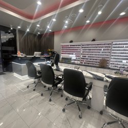 Pure Nails & Hair - Beautiful polish rack and manicure table for nail salon
