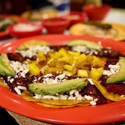 Tacos Del Julio - Savor the iconic blend of sweet and savory with our trompo tacos topped with juicy pineapple!