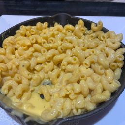 Vel   Runny velveeta Mac and cheese, not herb crusted like the menu stated.