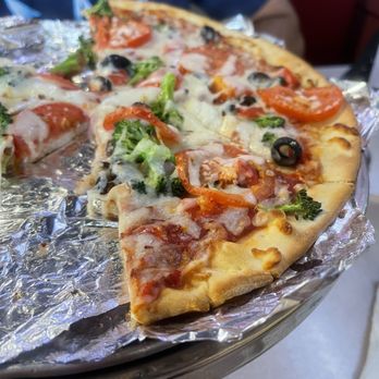 Sam & Louie's Italian Restaurant & New York Pizzeria - a half eaten pizza - Pizza Near Me - Alliance, Nebraska Sam & Louie's Italian Restaurant & New York Pizzeria - a half eaten pizza - Pizza Near Me - Alliance, Nebraska
