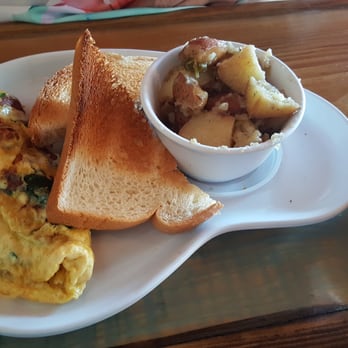 Two Chicks Cafe - Omelette with bacon, mushrooms, goat cheese, and spinach with a side of roasted potatoes! - Breakfast & Brunch Near Me - New Orleans, Louisiana Two Chicks Cafe - Omelette with bacon, mushrooms, goat cheese, and spinach with a side of roasted potatoes! - Breakfast & Brunch Near Me - New Orleans, Louisiana