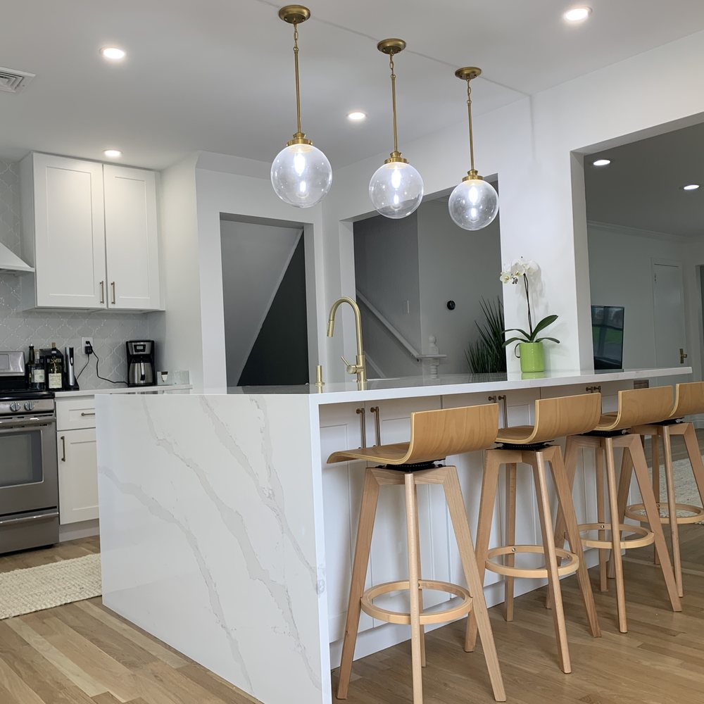 Jav Home Automation - a kitchen with a marble island - Home Automation Near Me - Queens, New York Jav Home Automation - a kitchen with a marble island - Home Automation Near Me - Queens, New York