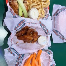 Wings N More Express - Half medium Parmesan/half spicy BBQ with curly fries and a side of carrots.