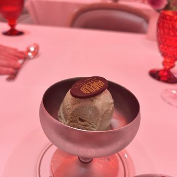 Rampoldi - we couldn't fit dessert, but they offered single scoops of ice cream! delicious! and a little chocolate with the logo! - French Near Me - New York, New York