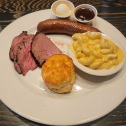Trip tip with sausage link. Sides of mac and cheese with biscuit. Trip tip with sausage link. Sides of mac and cheese with biscuit.